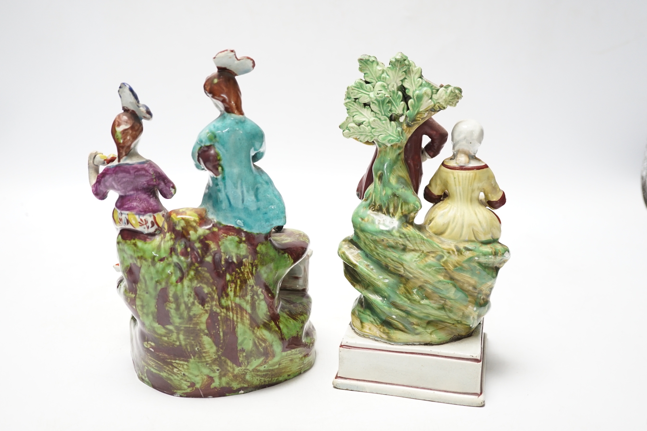Two Staffordshire pearlware groups of musicians, c.1810-25, largest 20cm high